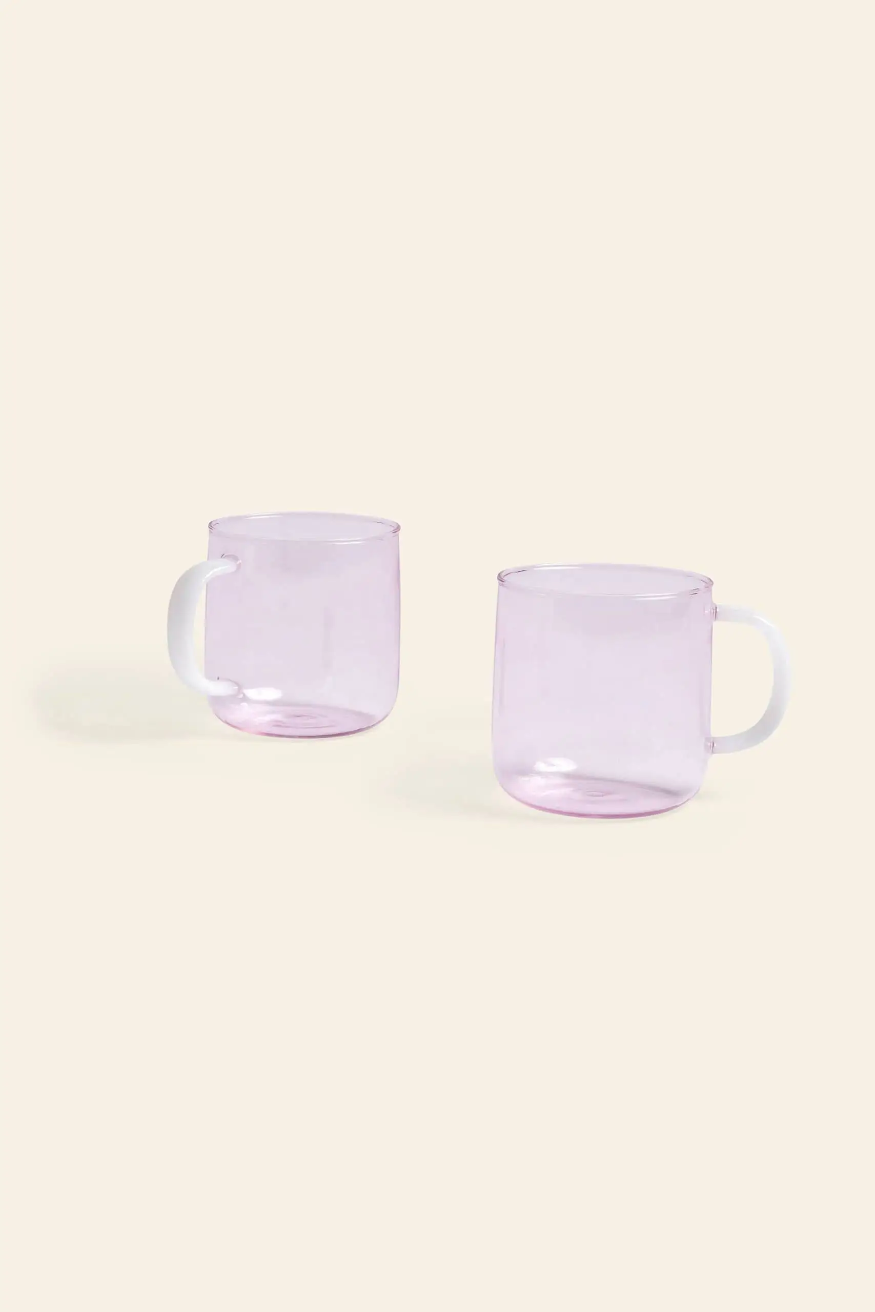 https://stacked-store.sgp1.digitaloceanspaces.com/wp-content/uploads/2023/08/03122506/HAY-Borosilicate-Mug-Set-of-2-Pink-With-White-Handle-1.webp